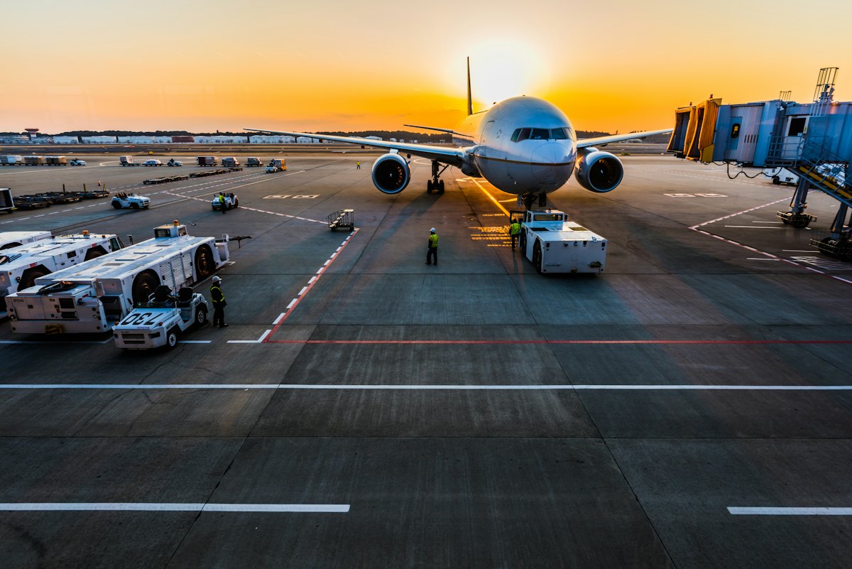 Ground crew servicing an aircraft on the apron